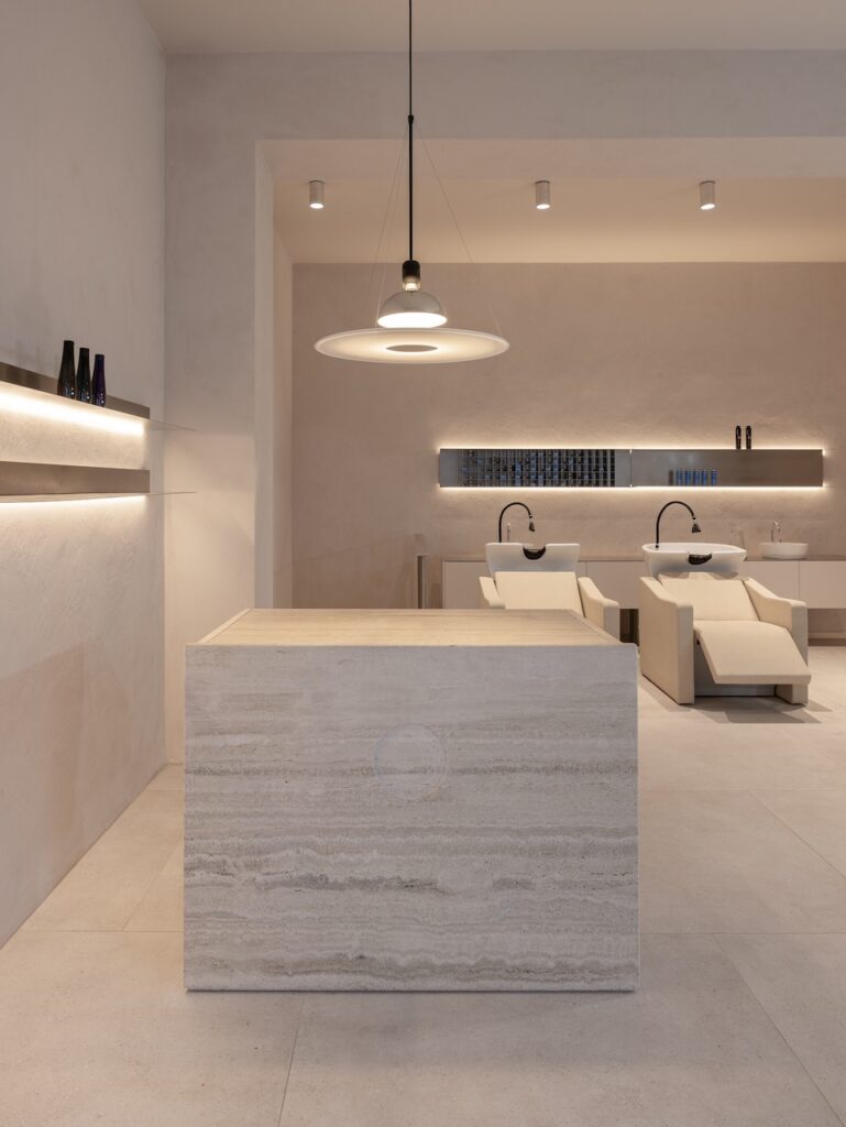 Stainless steel wall shelves with integrated light at circlé salon, Bratislava