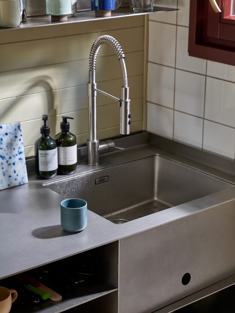 Stainless steel sink and worktop of a custom cottage kitchen