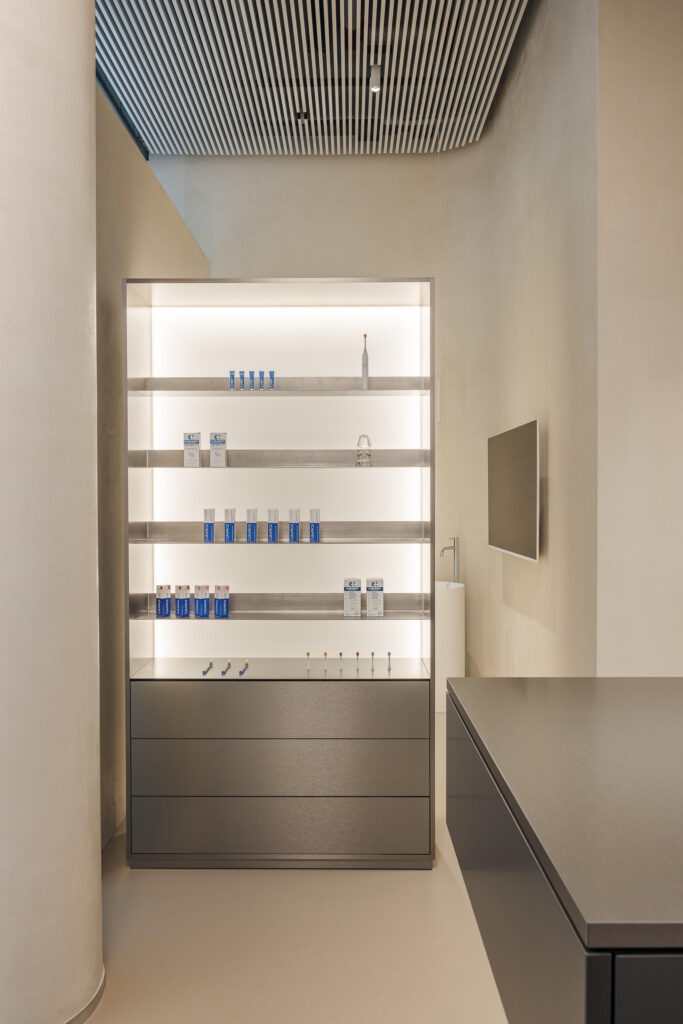 Backlit stainless steel shelving with drawers at a Dr. Martin dental clinic, Bratislava